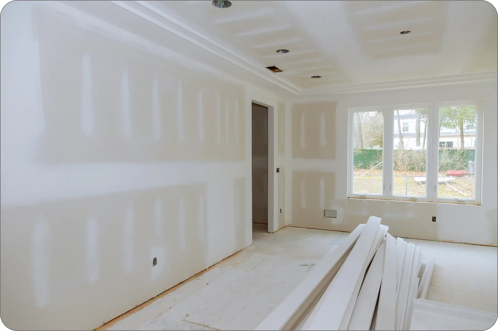 Bedroom with freshly mudded drywall